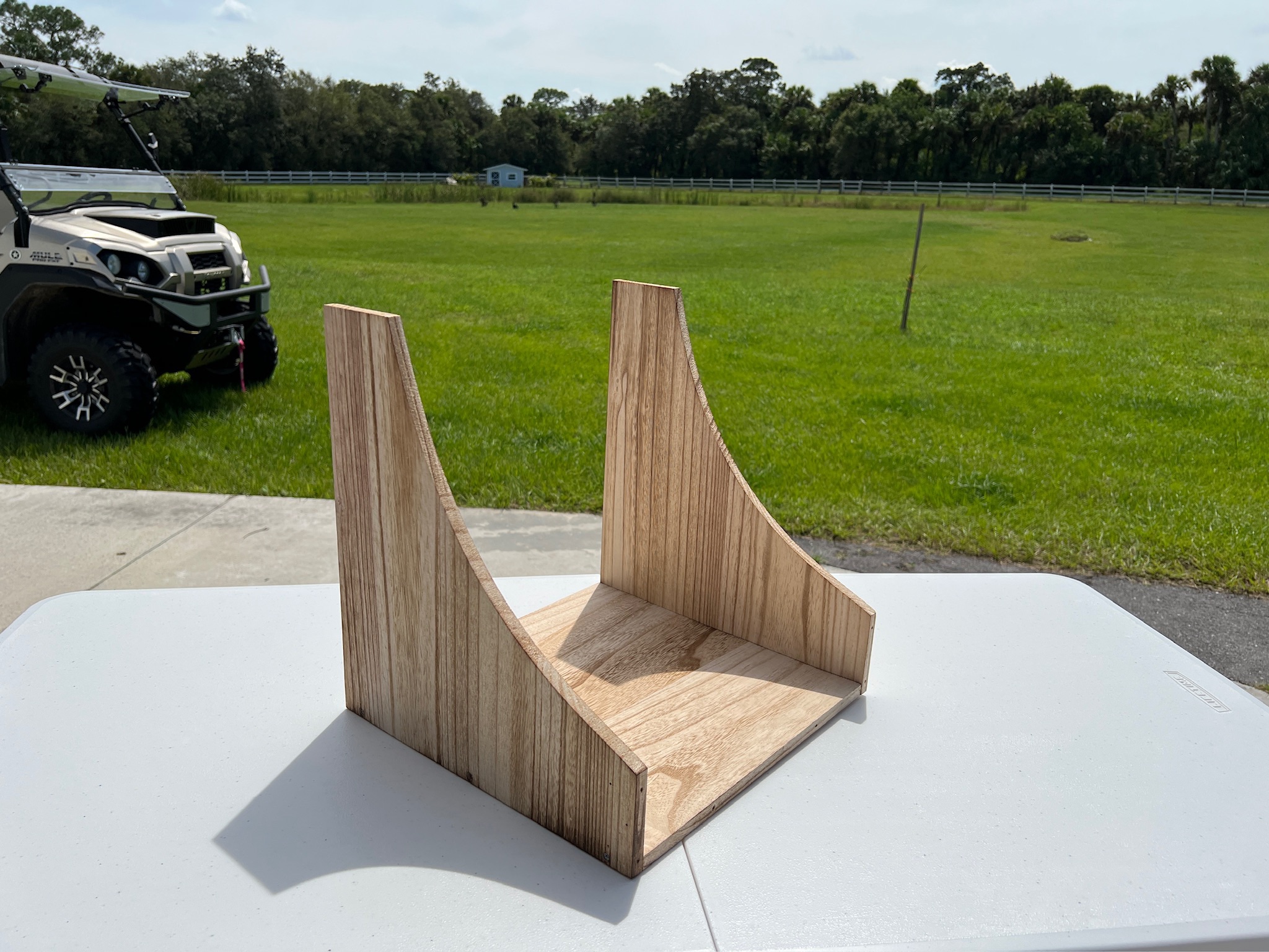 wood nesting box and supplies on a white table.