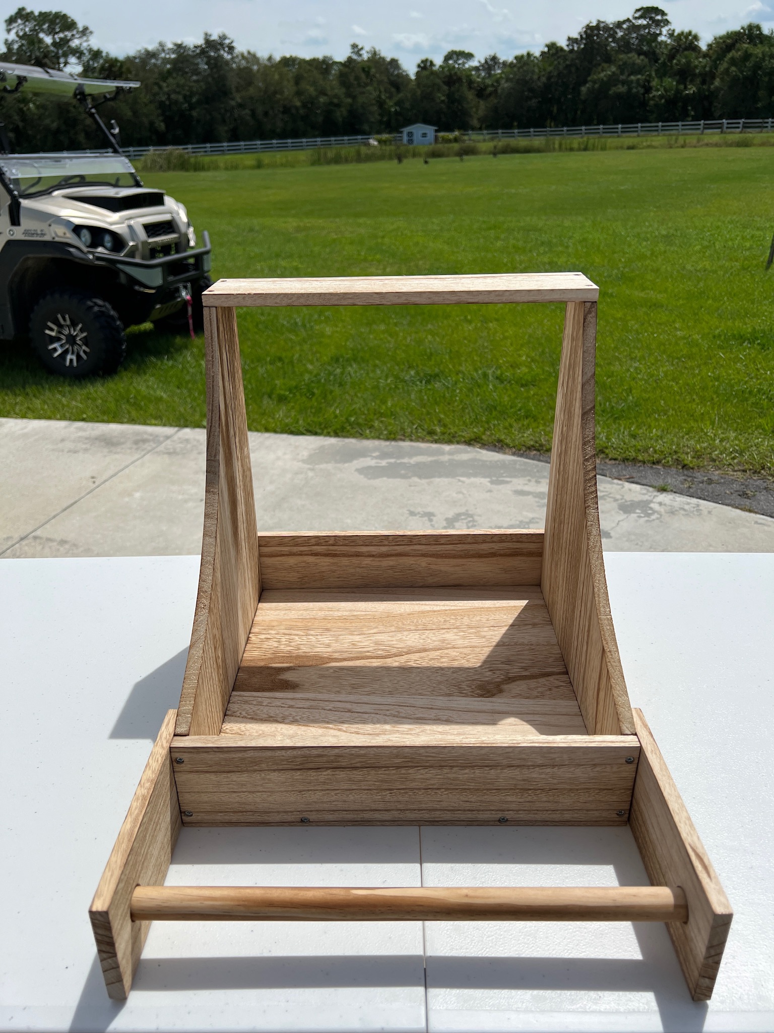 wood nesting box and supplies on a white table.